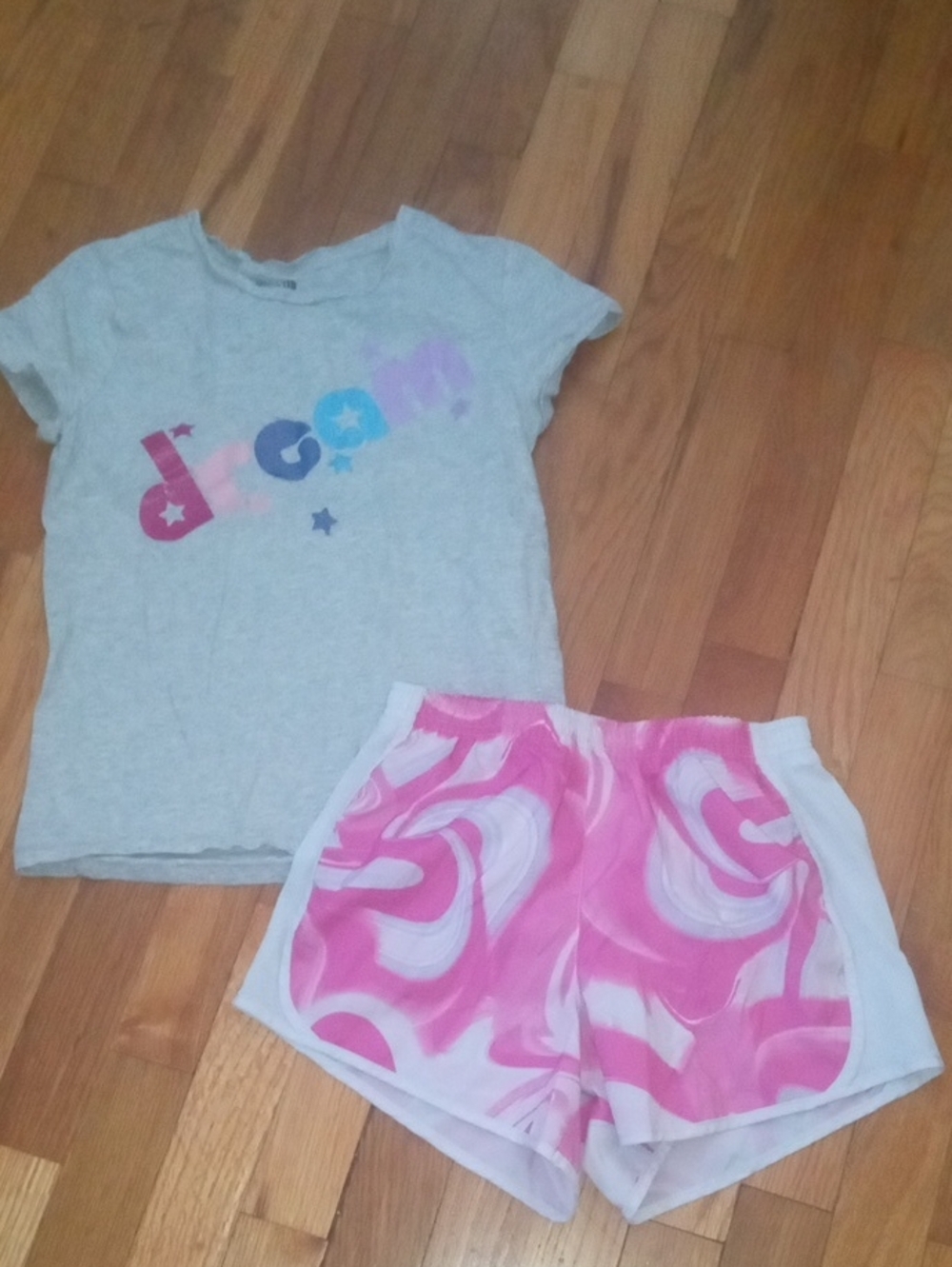 girl large pink drifit shorts and graphic tee